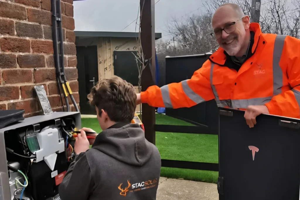 olar battery installation in Essex with engineer working on home energy storage system and Stag Solar team member supervising