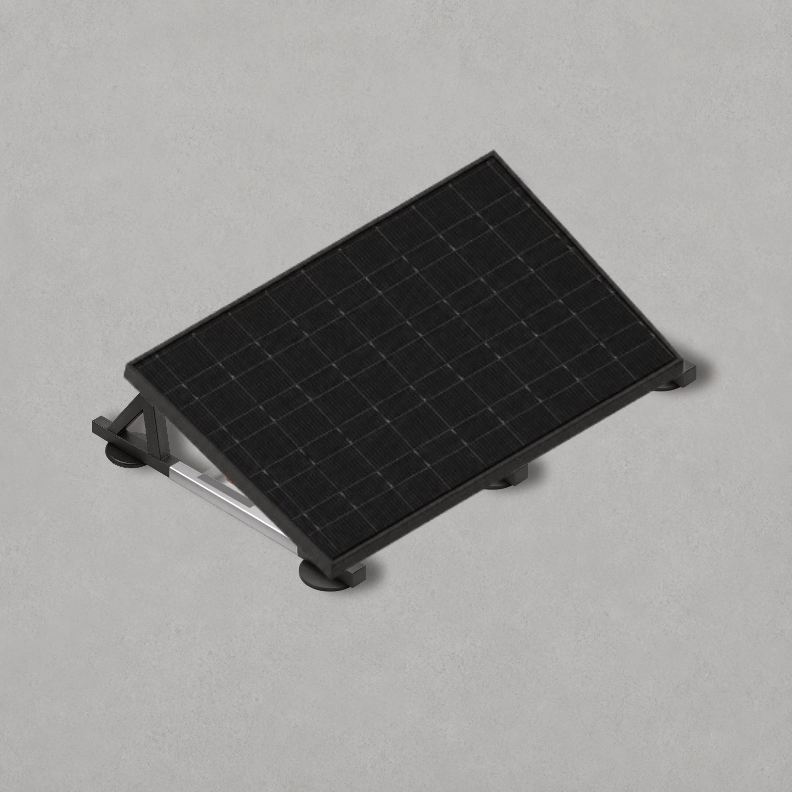 Black solar panel installed on a low-profile ballasted mounting system on a domestic flat roof, illustrating a completed flat roof solar PV installation.
